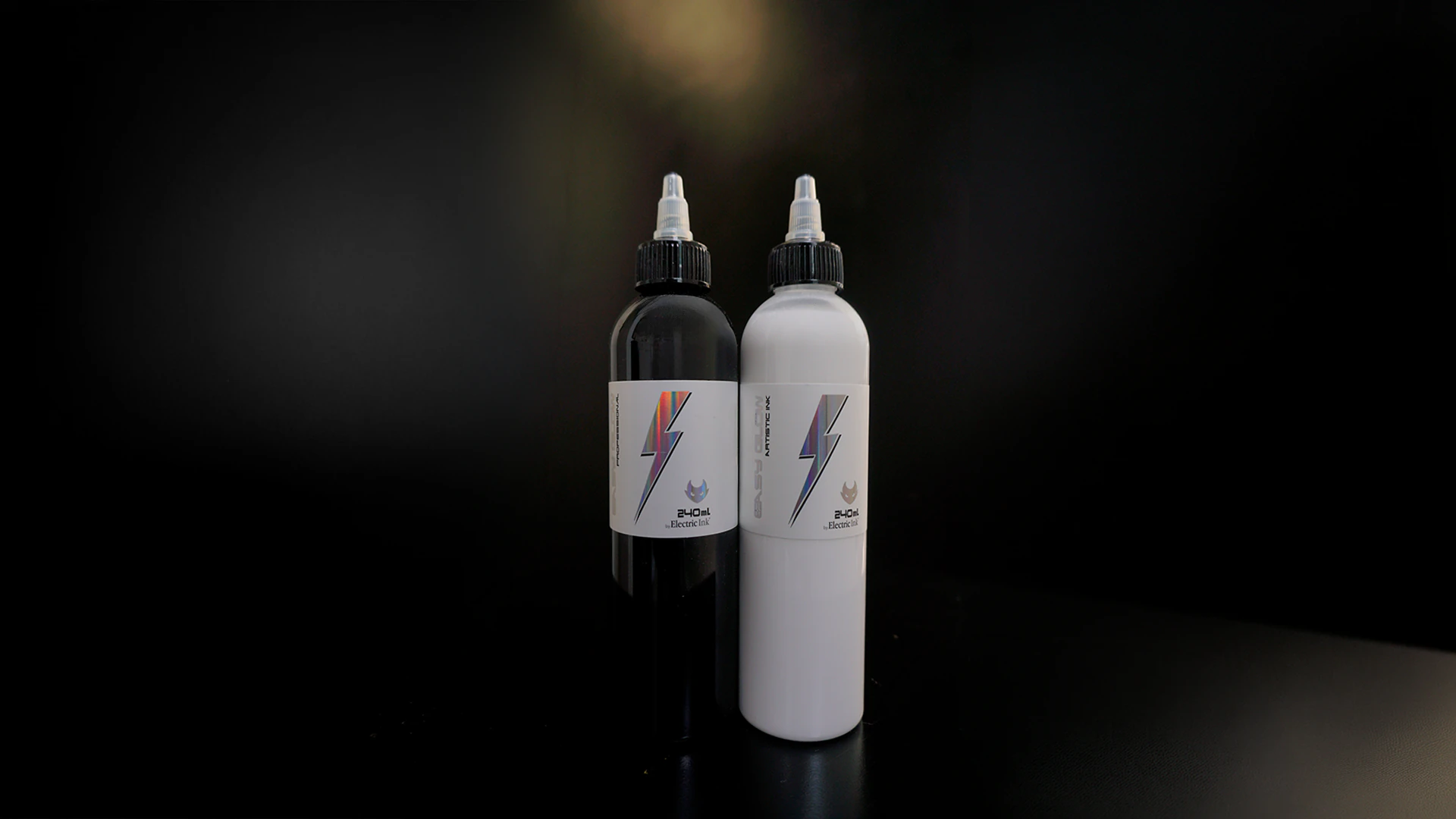 Raven Black and Ghost White 240 mL bottles side by side